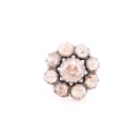 A yellow metal and diamond floral cluster ring, set with old rose-cut diamonds, in silvered setting,