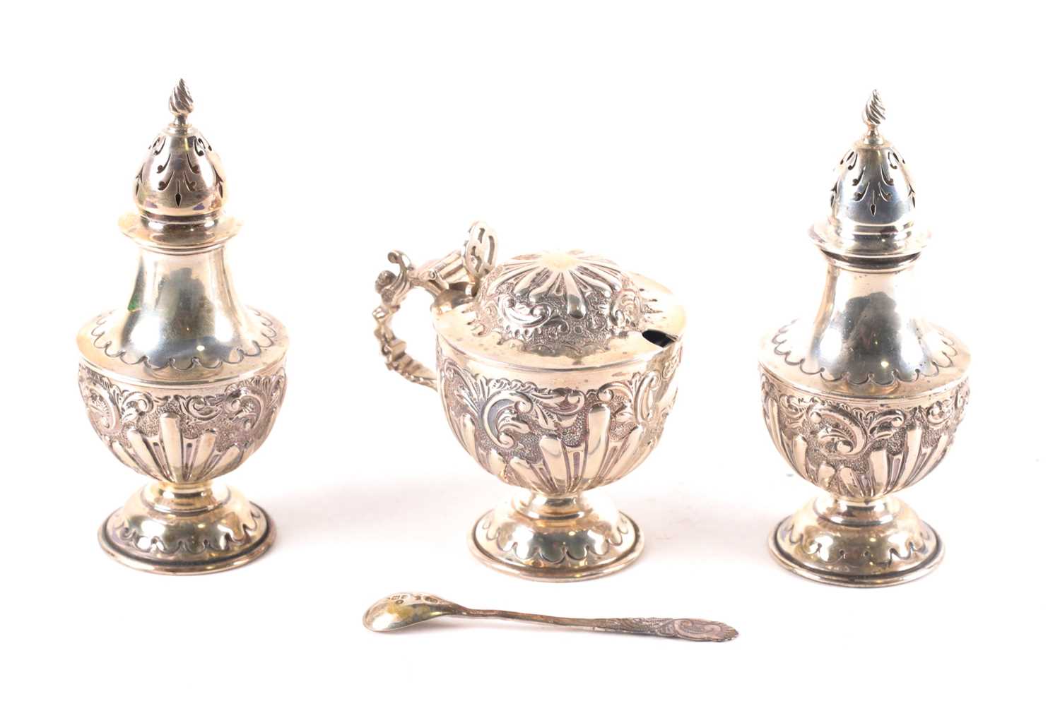 A late Victorian three-piece silver cruet set, London 1901 by Mappin Brothers, with embossed