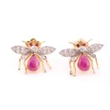 A pair of yellow metal, diamond, and ruby earrings in the form of bees, each bee with a diamond-