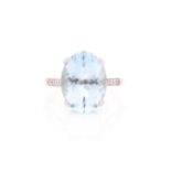 A single stone aquamarine ring, the oval cut aquamarine in four claw mount above five stone eight-