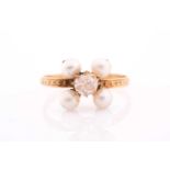 A late Victorian diamond and pearl ring, set with a rose-cut diamond and four round white pearls, on