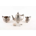 An Indian white metal three-piece tea set, marked 'P. Orr & Sons, Madras', comprising a teapot,