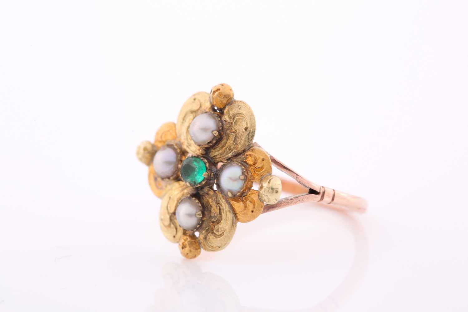 A 19th century yellow metal, emerald, and pearl ring, the quatrefoil mount with lightly engraved - Image 2 of 4