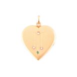 An early 20th century yellow metal heart-shaped locket pendant, the hinged front inset with small