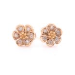 A pair of yellow metal and diamond floral cluster ear studs, together with a yellow metal and