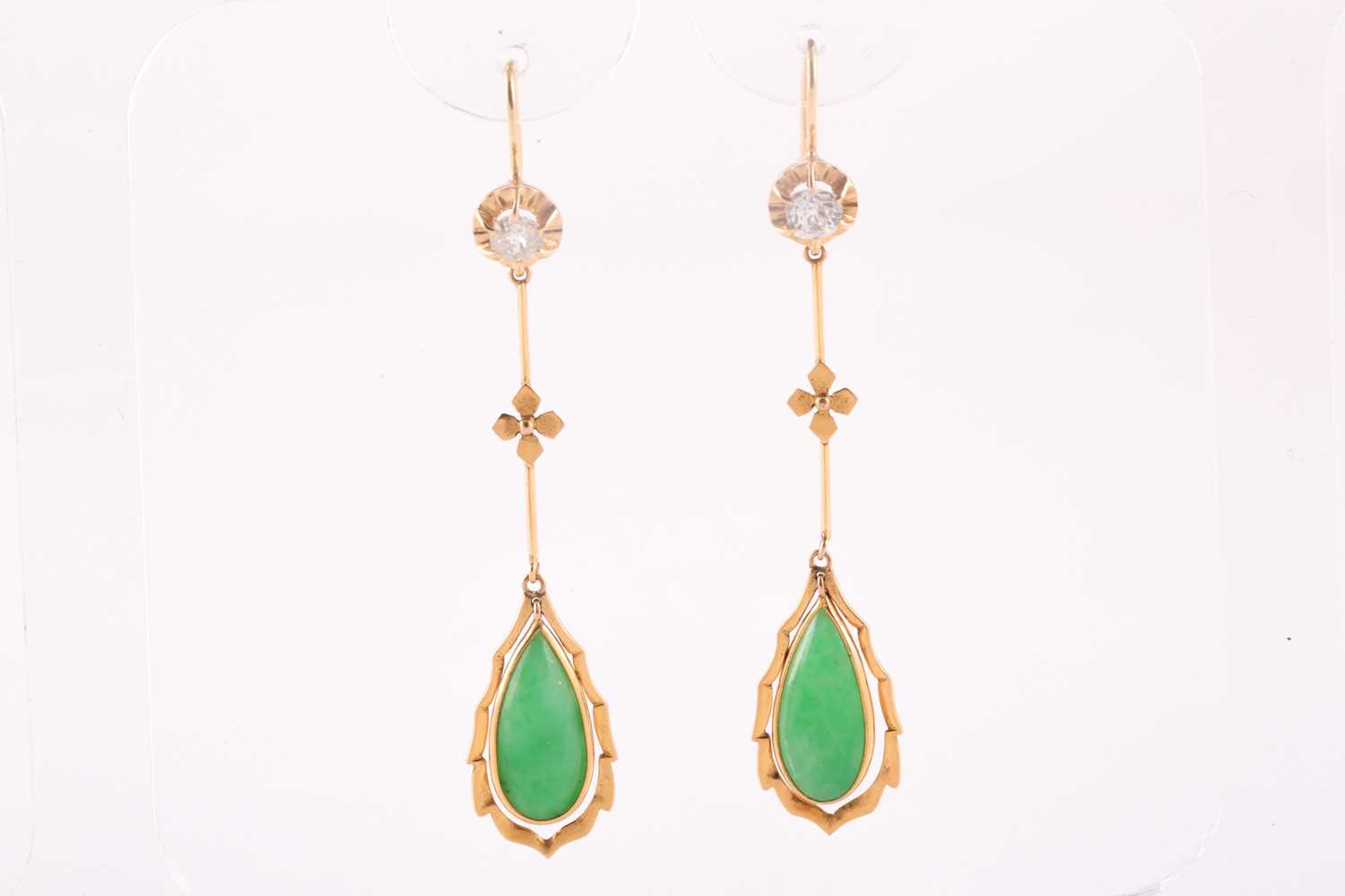 A pair of diamond and jade pendant earrings, each set with a pear-shaped jade plaque, bar-set with