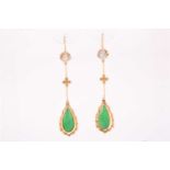 A pair of diamond and jade pendant earrings, each set with a pear-shaped jade plaque, bar-set with