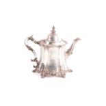 A Victorian teapot; London 1847 by Joseph Angell I and Joseph Angell II; circular panelled form,