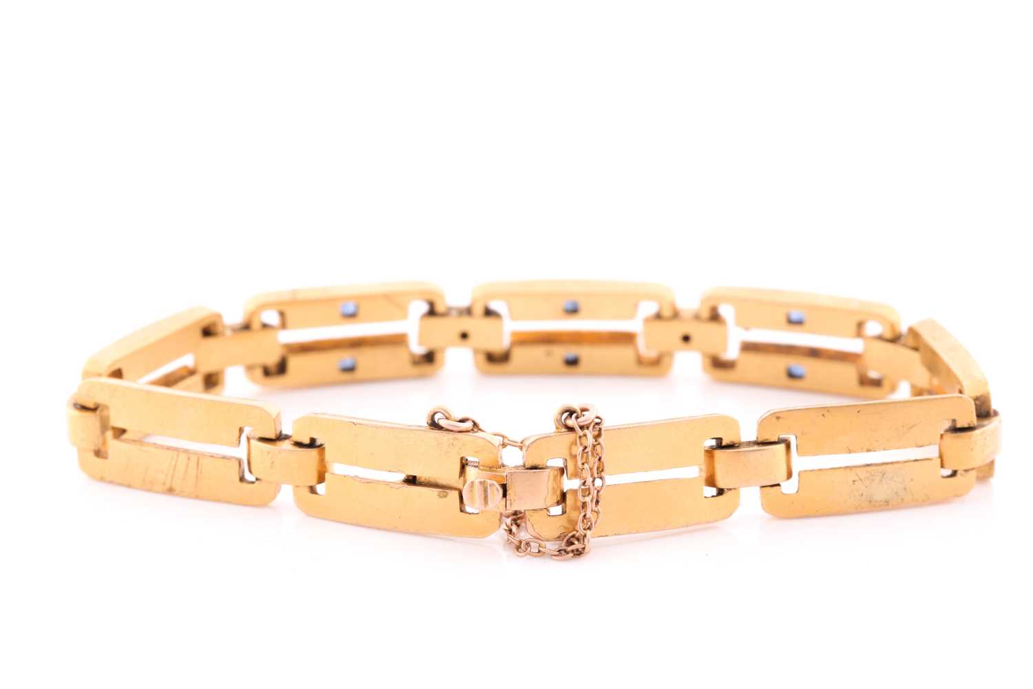 A yellow metal, diamond and sapphire bracelet, comprised of articulated bar links, the three - Image 4 of 4