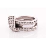 An unusual white metal and diamond ring, of folded knot design, inset with round brilliant-cut