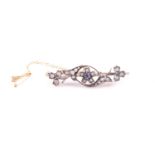 A late 19th / early 20th century yellow metal floral bar brooch, inset with old-cut diamonds and