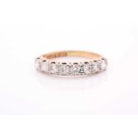 An 18ct yellow gold and diamond half hoop ring, set with eight round brilliant-cut diamonds of