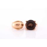 A 14ct yellow gold and smoky quartz ring, the stylised seventies-style mount set with a mixed