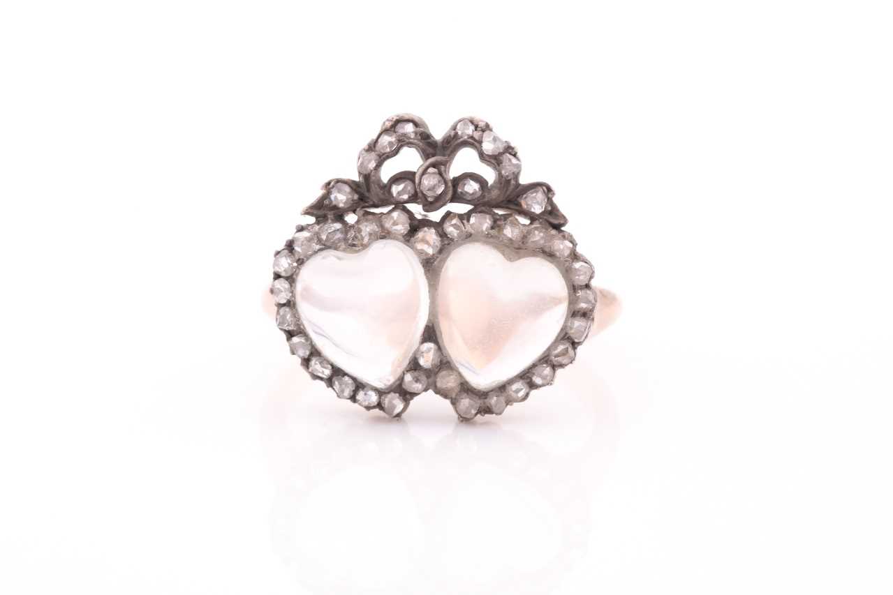 An antique diamond and moonstone double heart ring, the mount set with heart-shaped cabochon