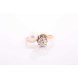 A French 18ct yellow gold, diamond, and pearl Toi et Moi ring, the crossover mount set with an old-