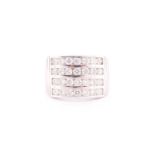 A diamond band ring, channel-set with four rows of round brilliant-cut diamonds of approximately 2.