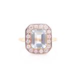 A diamond and aquamarine ring, set with an emerald-cut aquamarine of approximately 2.30 carats,