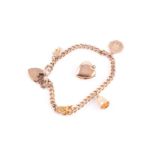 A 9 carat gold curb pattern charm bracelet, with padlock clasp and suspending four charms,