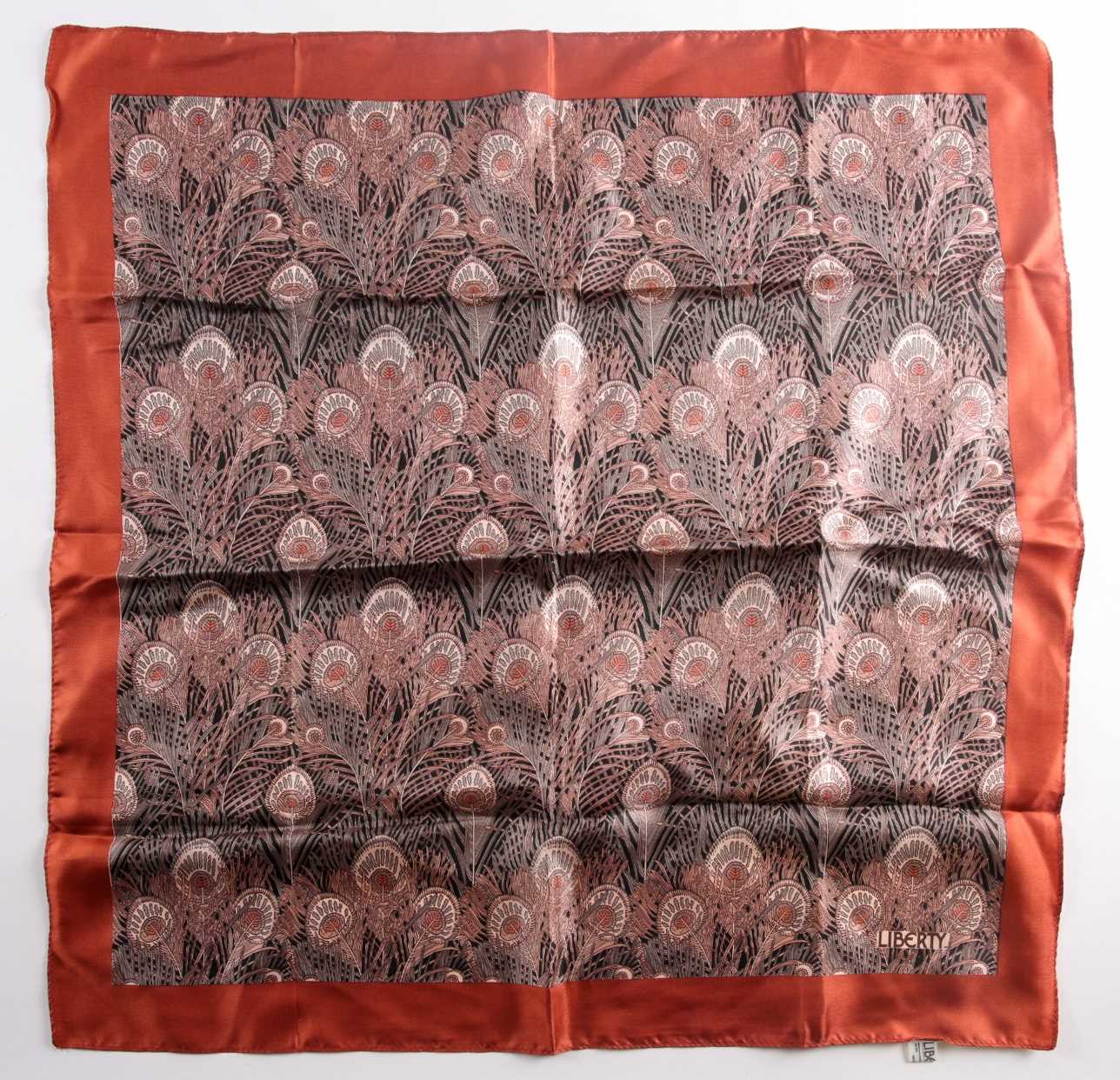 A Liberty silk square scarf with peacock feathers on a black ground with a rust border, together - Image 3 of 5