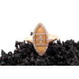 An antique diamond and gold ring, the navette-shaped mount with a diamond-set motif to centre in the