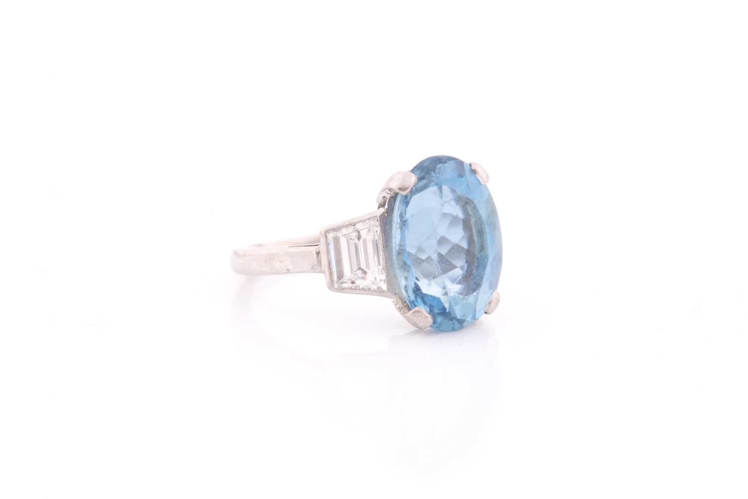 A diamond and blue topaz ring, set with a mixed oval-cut topaz, measuring approximately 12 x 8.5 mm, - Image 4 of 4