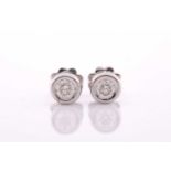 A pair of collet-set diamond solitaire ear studs, set with round brilliant-cut diamonds of