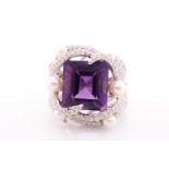 An impressive diamond and amethyst cocktail ring, centred with a mixed square-cut amethyst,