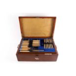 An early 20th century Elkington silver plated canteen of flatware, in branded oak case, twelve