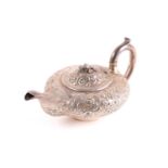 A William IV silver teapot, London 1830 by Joseph Angell, of squat form with repoussé foliate