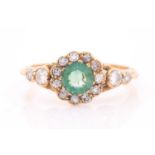 An 18ct yellow gold, diamond, and emerald ring, set with a mixed round-cut emerald, approximately