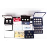Seven boxed commemorative coin sets, comprising: 1953 Coronation Sixpence in gold-plated diamond