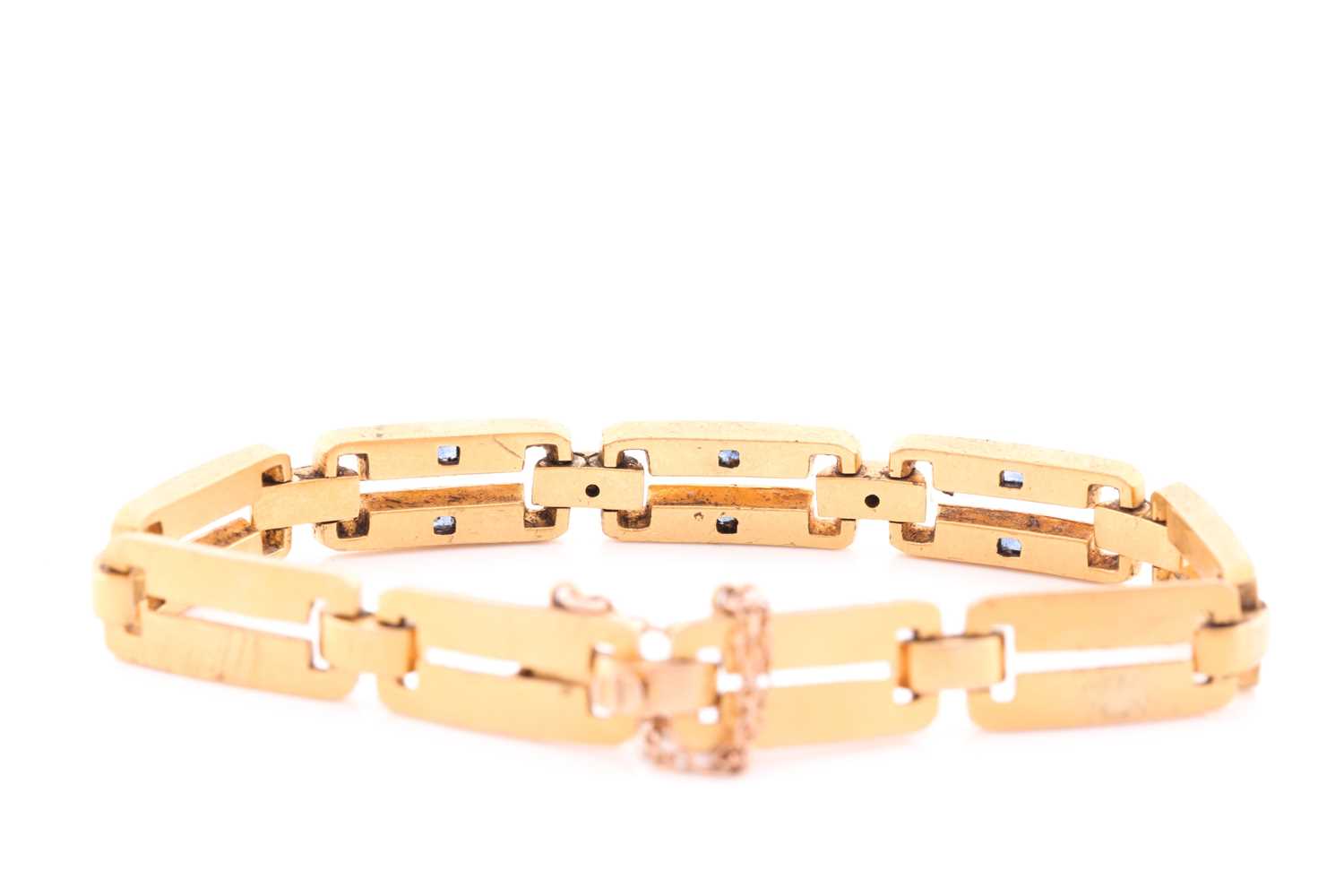 A yellow metal, diamond and sapphire bracelet, comprised of articulated bar links, the three - Image 3 of 4