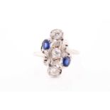 A diamond and sapphire ring, in the Art Nouveau style, the stylised mount inset with old Mine