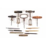 A collection of vintage and antique corkscrews including a rosewood handled cellar corkscrew,