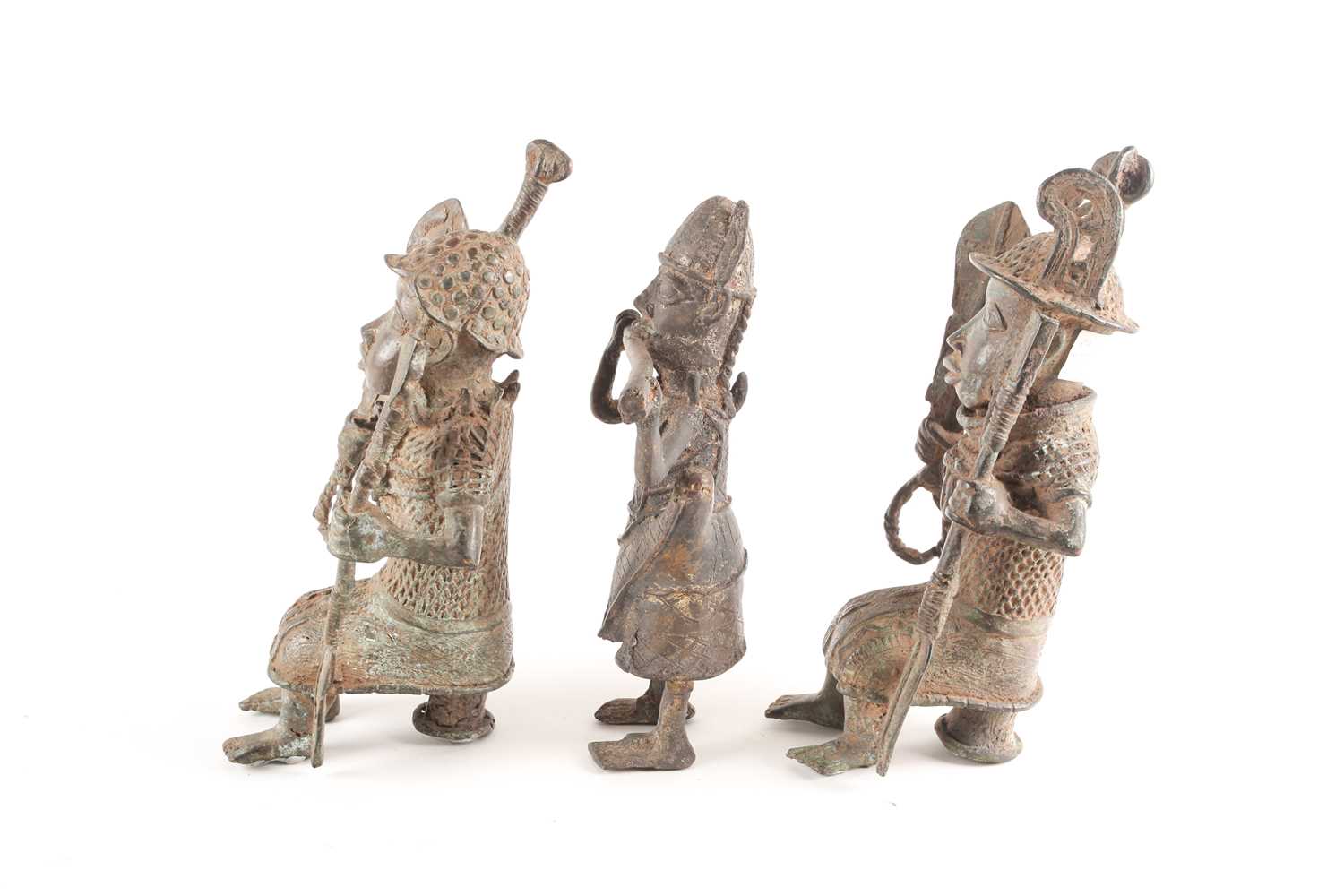 A pair near of Benin bronze seated warriors, Nigeria, each holding a sword and spear, 29.5cm & 30cm; - Image 3 of 7