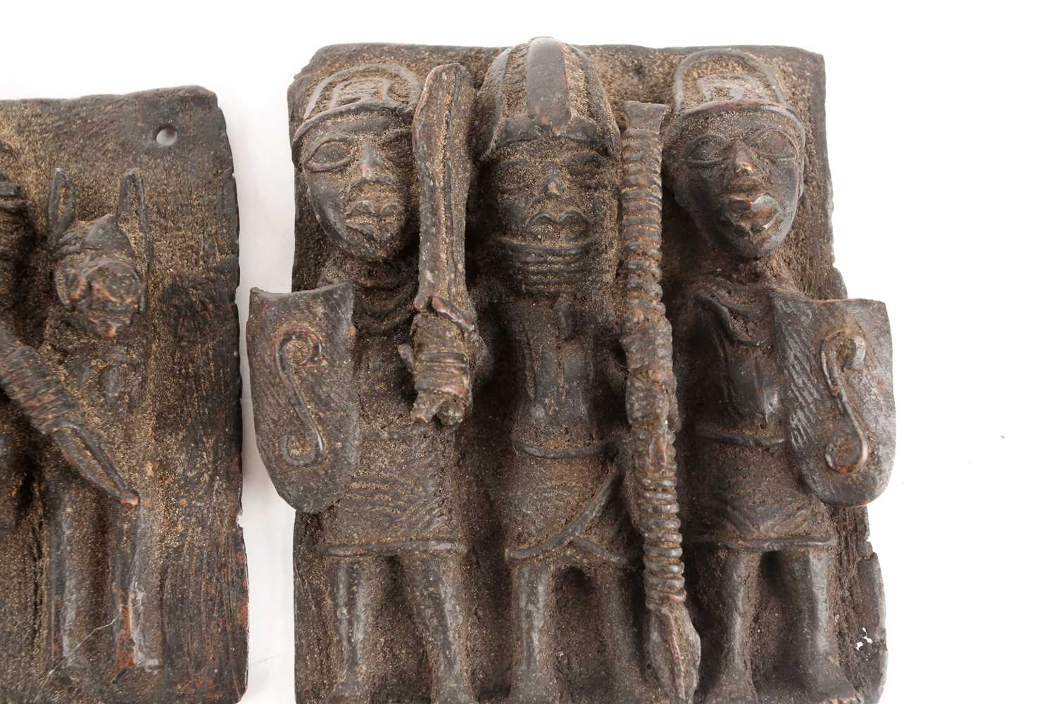 Three Benin bronze plaques, Nigeria, comprising an equestrian warrior and attendant, a group of - Image 2 of 5