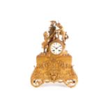 A late 19th-century eight-day ormolu mantle clock. With white enamel dial and moon hands, the silk