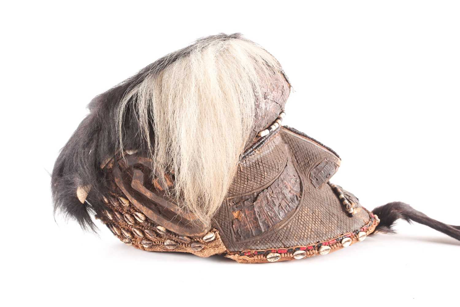 A Kuba Bwoom mask, Democratic Republic of Congo, the headdress of ox hide, carved throughout with - Image 2 of 7