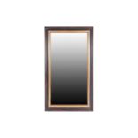 A rectangular wall mirror with distressed ebonized and parcel-gilt moulded frame. 133 cm high x 78
