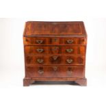 An early 18th century figured walnut fall front writing bureau. With fitted interior with well,