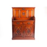 A late 19th-century Aesthetic design walnut fall front secretaire with fitted and leathered