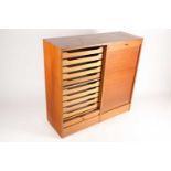 A 1960s Danish teak veneered tambour fronted cupboard with internal sliding trays. 101 cm wide x