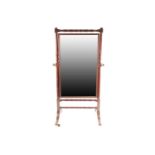 A George III mahogany rectangular cheval dressing mirror with turned frame. Supporting a reeded