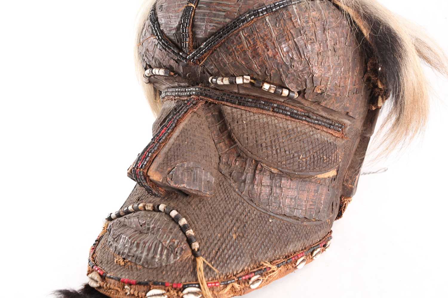 A Kuba Bwoom mask, Democratic Republic of Congo, the headdress of ox hide, carved throughout with - Image 4 of 7