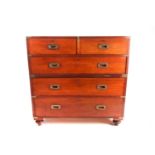 A 19th-century brass-bound mahogany campaign style two-section chest of drawers. Fitted with two