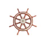 A teak wood ship's wheel with turned spindles and chromium-plated fitments. 77 cm diameter.Condition