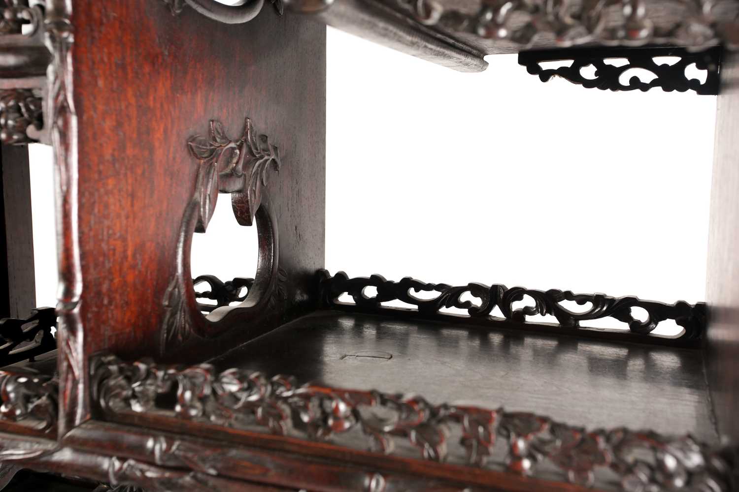 A Chinese hongmu open cabinet, early 20th century, carved throughout with Dogs of Fo, fruiting - Image 5 of 22