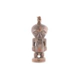 A Songye standing male power figure, Nkisi, Democratic Republic of Congo, the large head with
