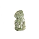 A Maori carved nephrite Tiki pendant, applied faded ink inscribed labels verso read ' Made for