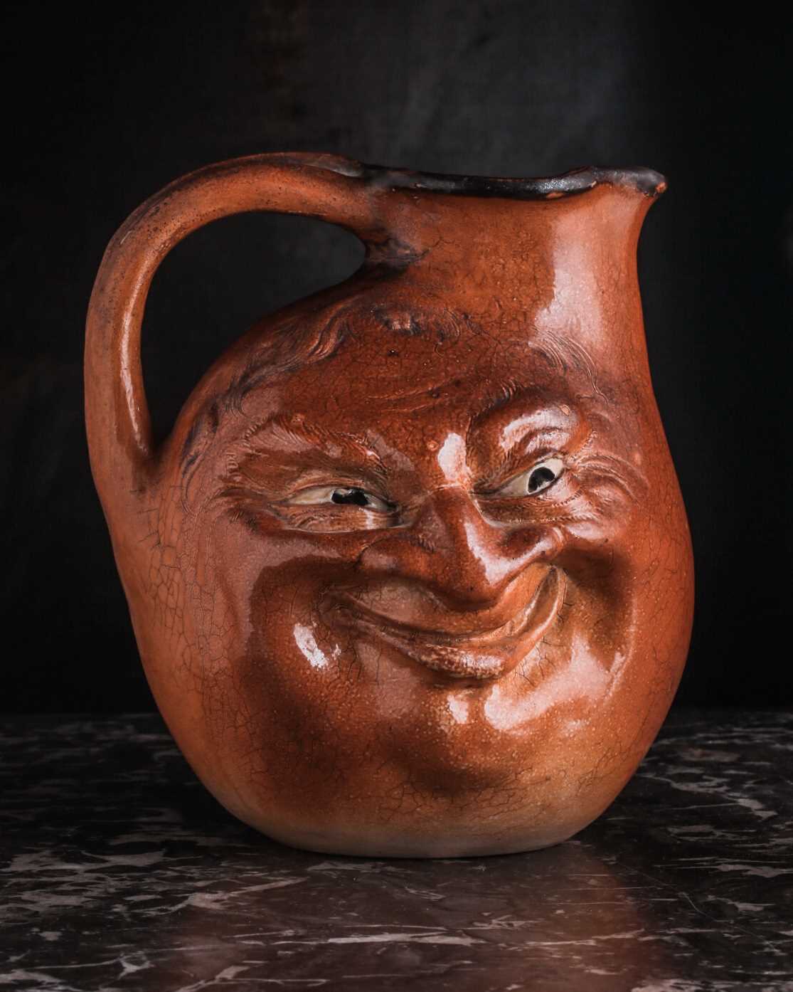 A Martin Brothers large double-sided stoneware face jug, dated 1899, modelled in relief to both - Image 14 of 15